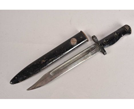 A British SLR L1A3 bayonet and scabbard, having indistinctive stamp to the grip, (2)