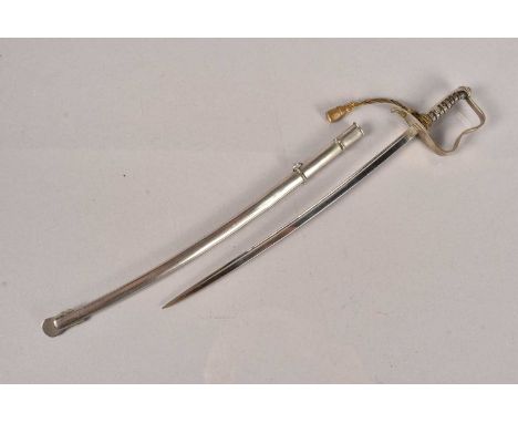 A letter opener in the form of a British Cavalry sword, complete with scabbard and knot