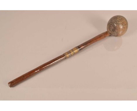 An African Hardwood Knobkerrie, having 45.5cm long shaft, bearing mixed metal bound wire collar, with bulbous head, with cham