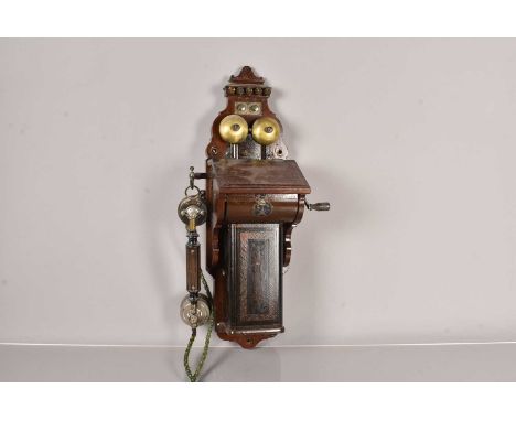 A pre 1900 Ericsson Wall Telephone, c.1895, possibly Model 355, having writing slope, tin battery cover with attractive decor