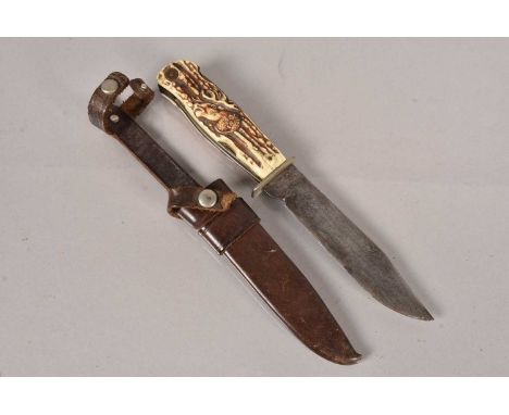 A vintage German Decora Solingen Multi-tool Hunting knife, complete with leather scabbard