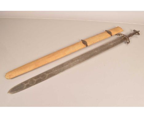 A Persian Processional Sword, having 79cm long engraved double edged blade, having Persian script to both side, with floral d