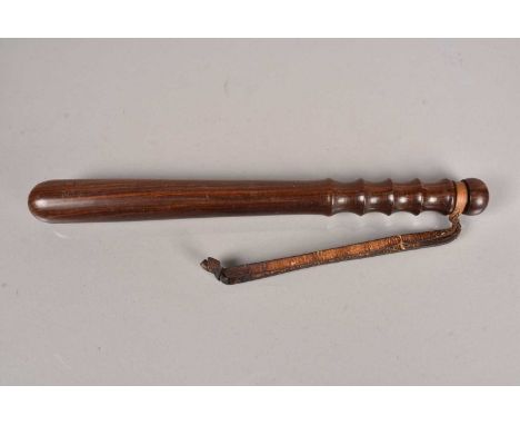 A British Police Special Constable wooden truncheon, stamped B.P SC R, with number 4043, with leather wrist strap