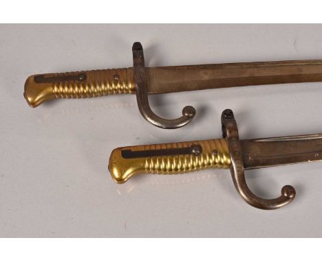 An 1893 dated Yataghan by P.Stevens, serial number 954, brass grip, with the pommel being stamped D, together with another si