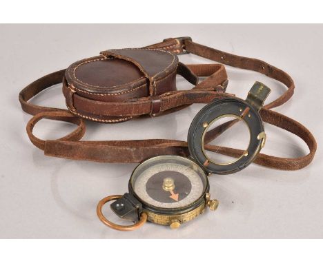 A WWI Field Pocket Compass, dated 1917, No.71496, complete with leather carry case, stamped with a broad arrow, with initials