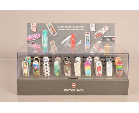 Victorinox - Classic Penknife Display, containing 20 Victorinox Classic Knives, dated 2020 to 2021, under perspex with a deco