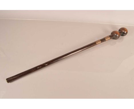 An Unusual African Double Headed Knobkerrie, having two bulbous heads to the top of a 69cm long shaft with two mixed metal wi