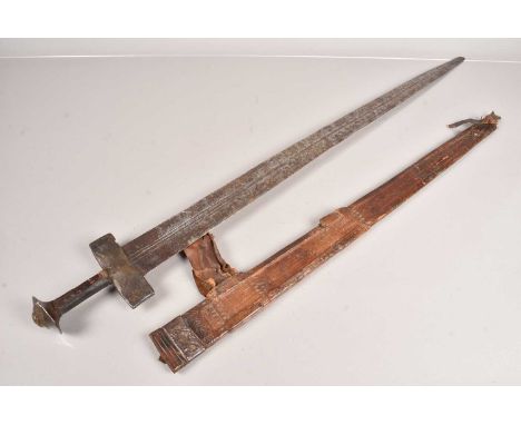 A Sudanese Broad Sword, similar to a Kaskara sword, having an 80cm long, double edged blade, with two crescent moon style sta