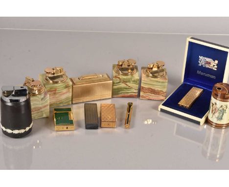 A collection of pocket and table lighters, to include a Ronson, Flaminaire Gold Plated, Aspinalls, numerous onyx table lighte