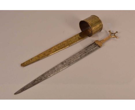 An African Arm Dagger, having 39.5cm long double edged, double fullered blade, brass guard, with decoratively engraved scabba