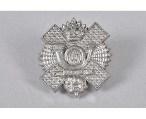 Highland Light Infantry, WWII Plastic Economy Cap Badge, in grey, two blades to reverse (1)