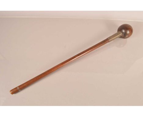 An African Hardwood Knobkerrie, having tapering 60cm long shaft, with mixed metal wire bound collar to the top, with bulbous 