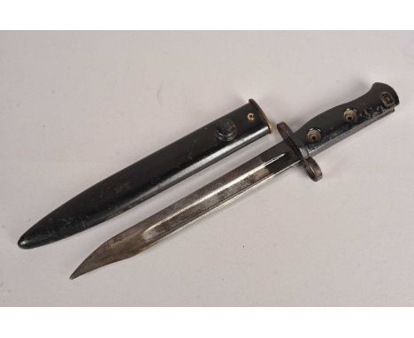 A British SLR L1A3 bayonet and scabbard, having indistinctive stamp to the grip, (2)