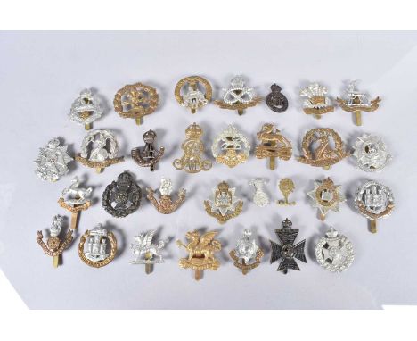 A good collection of British cap badges, comprising The Norfolk Regiment, The Border Regiment, The Loyal Regiment Loyal North