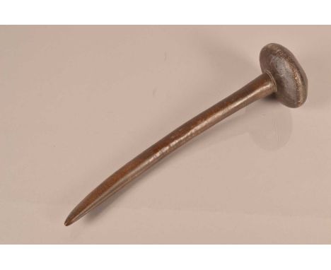 An unusual Knobkerrie/ Club, having 35cm long curved shaft, with flattened bulbous head, with indent to the topthere is viewi