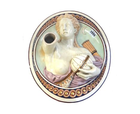 A pair of majolica pottery figural wall lights, early 20th century each semi nude female emblematic of the Arts, moulded in r