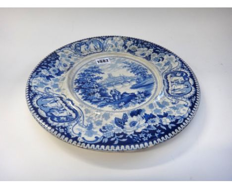 A Herculaneum blue and white earthenware blue and white circular stand, circa 1830, printed with a titled view of Worcester, 