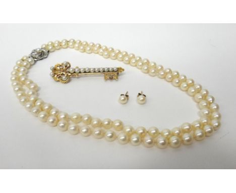 A two row necklace of uniform cultured pearls, on a white gold and cultured pearl clasp, detailed 750, a gold and cultured pe