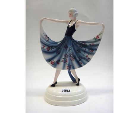 A Goldscheider  figure, circa 1930, modelled as an Art Deco female dancer in a floral print dress, impressed '6207/15/6', wit