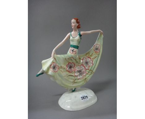 A Myott & Sons Goldscheider pottery figure, circa 1930, modelled as a female Art Deco dancer, in a green floral dress, 31cm h