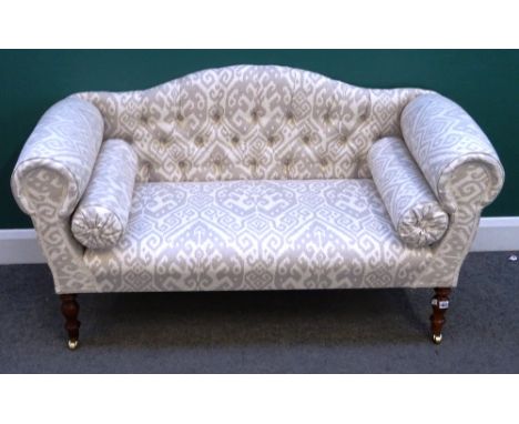 A modern small hump back sofa with roll over arms on turned supports, 140cm wide x 77cm high.