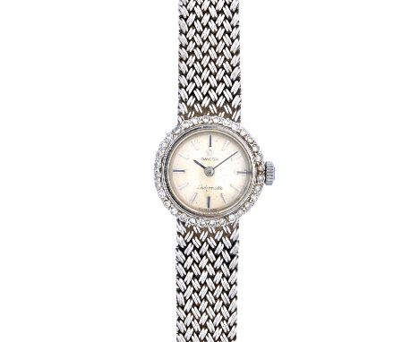 An Omega Ladymatic 18ct white gold and diamond set dress bracelet wristwatch, the jewelled movement detailed Omega Watch Co, 