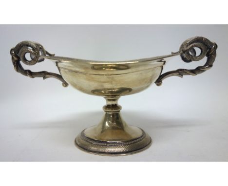 A European twin handled pedestal tazza, of ovoid form, having scrolling handles and decorated with an engine turned border to