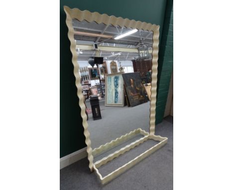 A mid 20th century console table and mirror with undulating wriggle work vellum veneered frame, 134cm wide x 170cm high x 30c