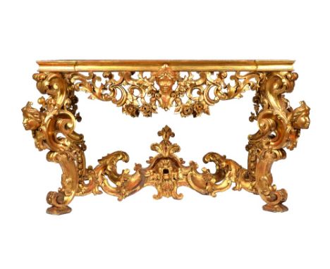 A 19th century carved giltwood console table base of 18th century design, the rectangular top lacking marble, over a carved a