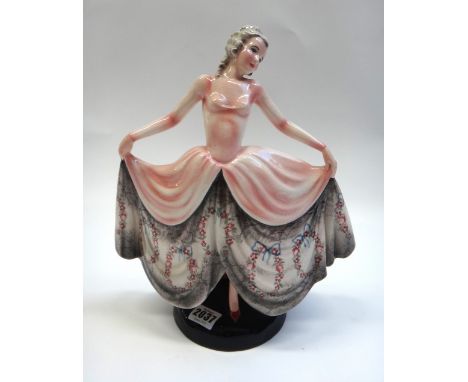 A Goldscheider figure of a dancer, circa 1930, modelled in a pink floral print dress, model no.8301, impressed and printed ma