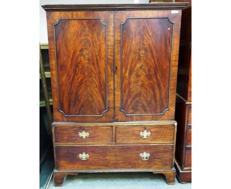 A mid 18th century mahogany linen press, the pair of panel doors over two short and one long drawer, on bracket feet, 123cm w