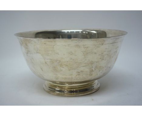 A silver large bowl of plain circular form, raised on a circular foot, diameter 29cm, detailed Paul Revere Reproduction, Inte