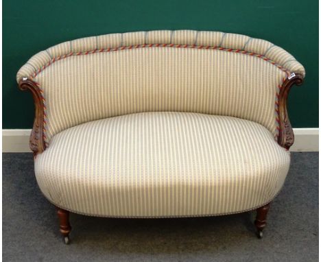 A 19th century two seat small shaped sofa, with acanthus carved scrolling arms and bow seat, on turned supports, 125cm wide x