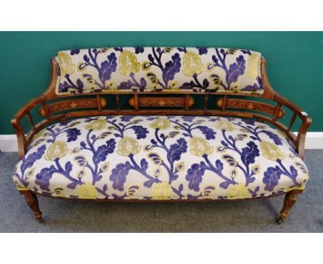 An Edwardian marquetry inlaid rosewood tub back sofa, with bow seat on spiral supports, 148cm wide x 77cm high.