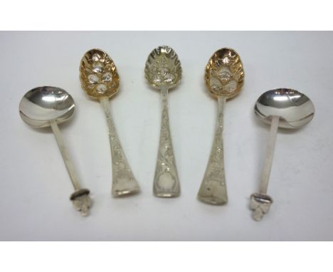 Three Irish silver berry fruit spoons, having differing decoration of a later date, Dublin 1766, 1771 and 1773 and a two simi