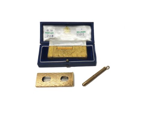 A Kutchinsky 9ct gold mounted steel slide action cigar cutter, with bark textured decoration, London 1977, a 9ct gold cased p