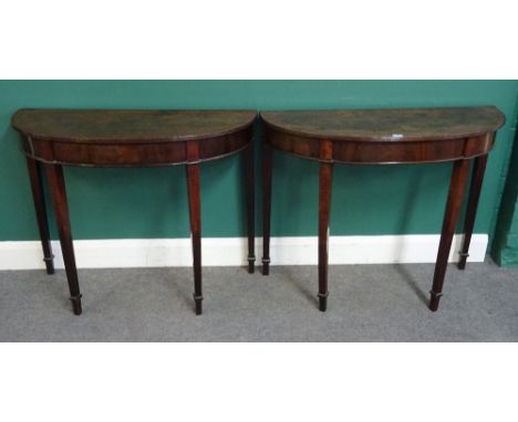 A pair of George III mahogany console tables, each with 'D' shape top on four tapering square supports, 98cm wide x 78cm high