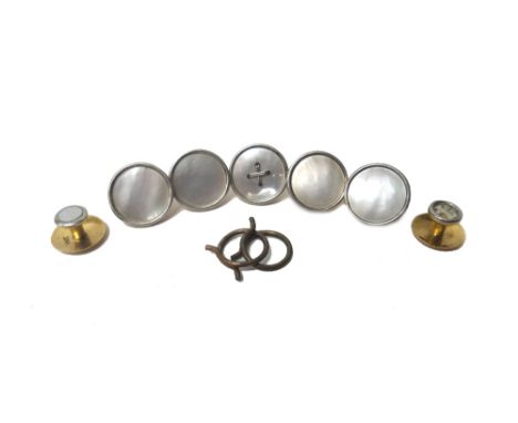 Four gold mounted mother of pearl dress buttons, detailed 18 CT and two loop fittings, another gold mounted mother of pearl d