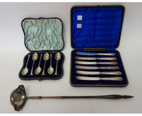 A set of six Victorian silver coffee spoons, London 1895, with a case, a set of six tea knives, with loaded silver handles an