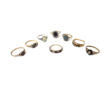 An 18ct gold, diamond and pale blue gem set oval cluster ring, a 9ct gold, sapphire and diamond set seven stone cluster ring,