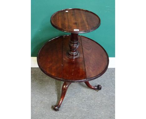 A George III mahogany drop flap two tier circular dumb waiter on tripod base, 62cm wide x 80cm high. 