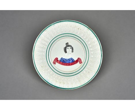 A commemorative Queen Victoria pottery plate, 19th century, possibly Scottish, moulded with a head and shoulders portrait abo
