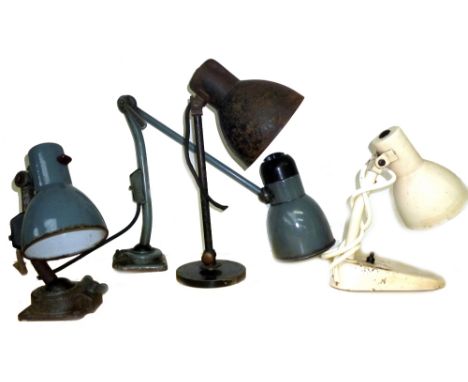 Kandem; four desk lamps by or attributed to Marianne Brandt, including two grey machinist lamps with ball-joint bases, a slip