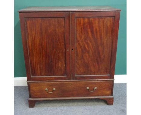 A small George III mahogany linen press, the pair of panel doors over single drawer, on bracket feet, 110cm wide x 123cm high