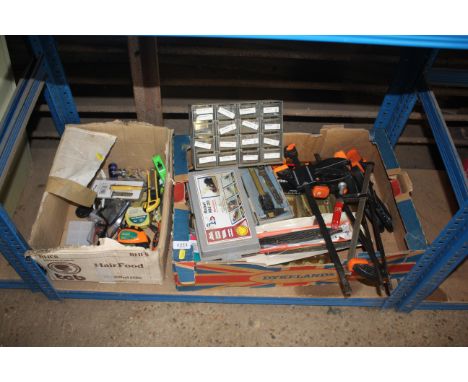 A box containing various tools to include quick release clamps, measuring calipers, a Rabot Kids 20 smoothing plane and a box