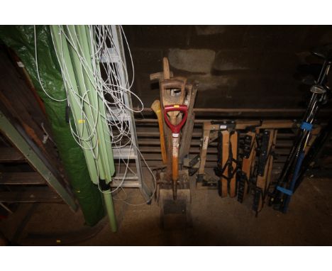 A quantity of wooden handled garden tools to include digging fork, spades, shovel etc