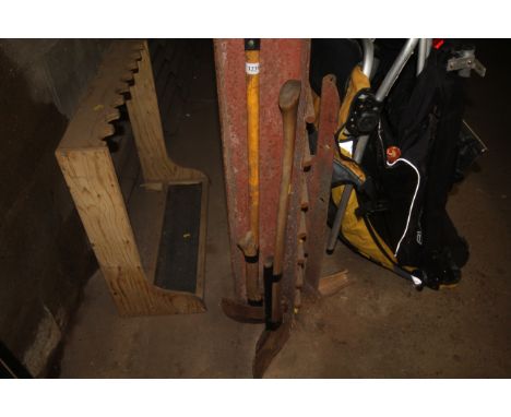 Two short handled axes, a long handled axe and a turf edger
