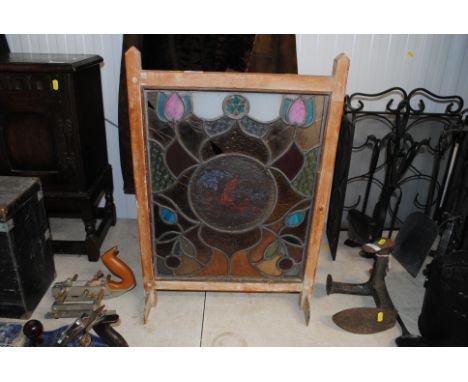 A wooden framed and stained glass fire screen AF