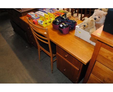 An oak desk and a ladder back chair