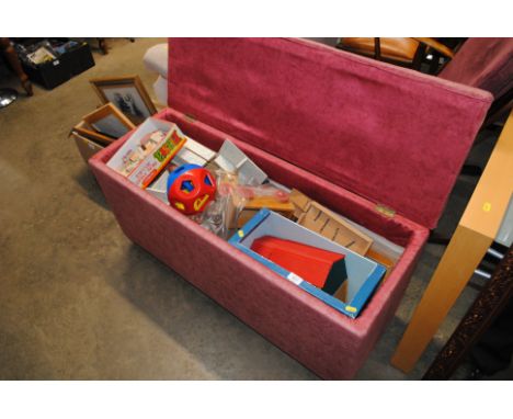 An upholstered ottoman and contents of vintage and other children's toys